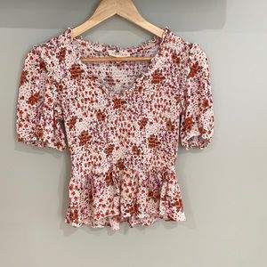 A floral cropped blouse in a size Medium.